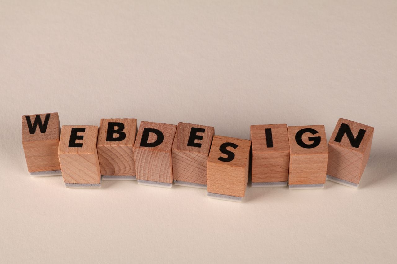 Services-01 Wooden blocks spelling web design creatively showcase digital design concept.
